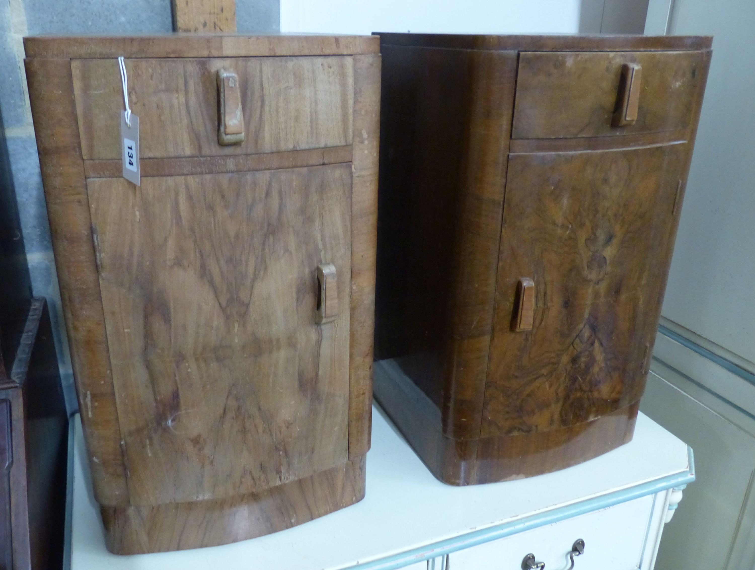 A pair of Art Deco walnut bedside cabinets, W.38cm D.38cm H.67cm